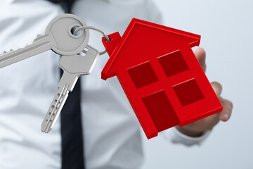 Image of a real estate agent holding house keys, perfect for property listings and real estate...