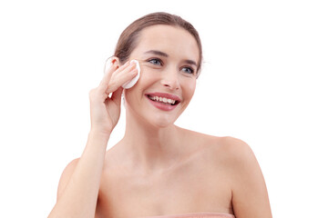 Smiling young woman cleansing her face with cotton pad and micellar water. Skincare routine, makeup removal, fresh healthy skin. Isolated on white background, beauty and hygiene concept