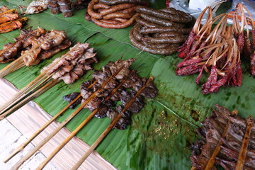 A table full of different types of meat and vegetables