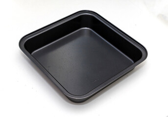 Clean square empty metal pan isolated on white