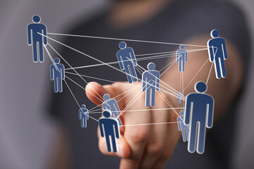 Image of a hand interacting with a network of connected people, representing global communication...