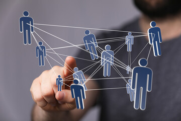 Image depicts a network of interconnected people, symbolizing teamwork, collaboration, and global...