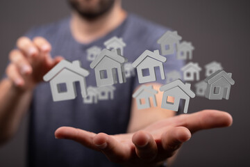 Image of a person showcasing multiple virtual houses, ideal for real estate, property, and home...