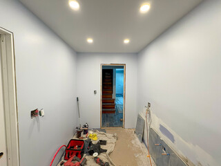 Renovated Bathroom Renovation With Fresh Paint and Lighting in Progress
