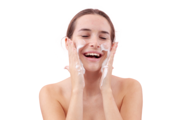 Happy smile young woman cleansing her face with foaming cleanser, hands covered in foam while applying it to her skin. Skincare routine for clean, healthy face. Isolated on white background, acne care