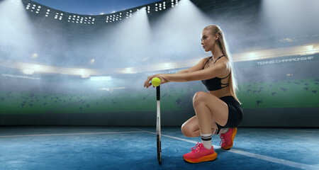 Woman tennis player playing tennis on professional tennis stadium in night.