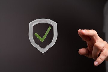 High-quality image of a digital shield with a checkmark, symbolizing data security and approval.