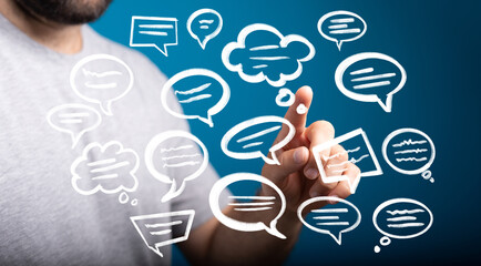 Image of a person interacting with digital speech bubbles, illustrating communication and feedback.