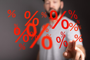 Image depicts a man interacting with floating percentage symbols, ideal for discount, sale, and...