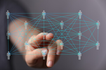 Hand interacts with a digital network, visualizing global connections and teamwork.