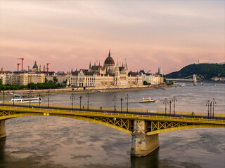 Scenic view of the famous Margit bridge acrossing over Danube river. Hungarian Parliament amazing building visible too in the photo