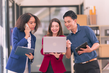 Group of business people discussing charts and graphs showing results of teamwork, analyzing financial data at desk in modern office about business strategy.
