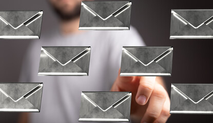 Close-up of a hand selecting digital email messages.  Perfect for communication, technology, and...