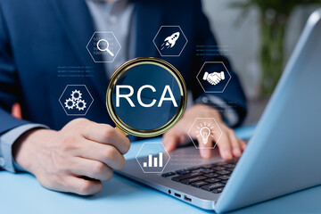 Root Cause Analysis Concept, Businessman holding magnifying glass with RCA symbol, represents...