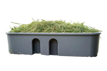 Gray plastic trough filled with hay