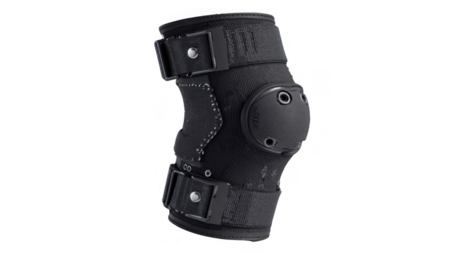 Black post op knee support brace featuring adjustable straps and hinges, offering stability and protection during recovery, isolated on a transparent background