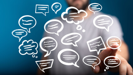 Stock photo of a person interacting with digital speech bubbles, ideal for communication, social...