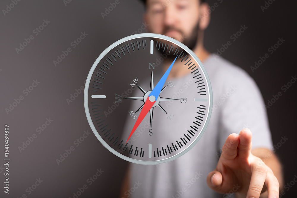Poster a man interacts with a digital compass, symbolizing guidance and decision-making.