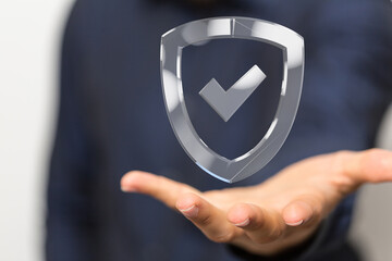 High-quality image of a hand holding a digital shield, symbolizing data protection, online...