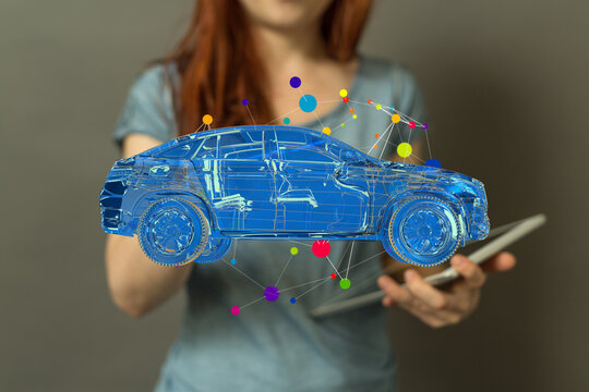 A woman uses a tablet to view a digital 3D model of a car.  Perfect for tech, innovation, and automotive concepts. - Powered by Adobe