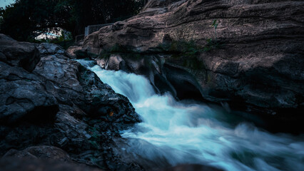 clear water flowing between rocks in a valley