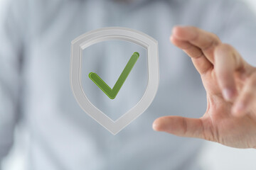 Image of a hand holding a shield with a checkmark, symbolizing data security and verification.