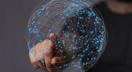 Abstract image of a hand interacting with a digital global network.  Perfect for technology,...