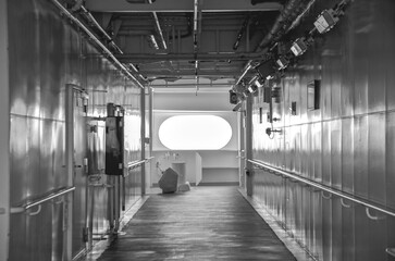 Outdoor promenade boat pool deck onboard modern luxury cruiseship cruise ship ocean liner with sun loungers and deck chairs for guests passengers with ocean views