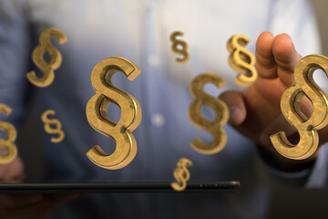 3D golden paragraph symbols hover above a tablet, illustrating legal concepts.