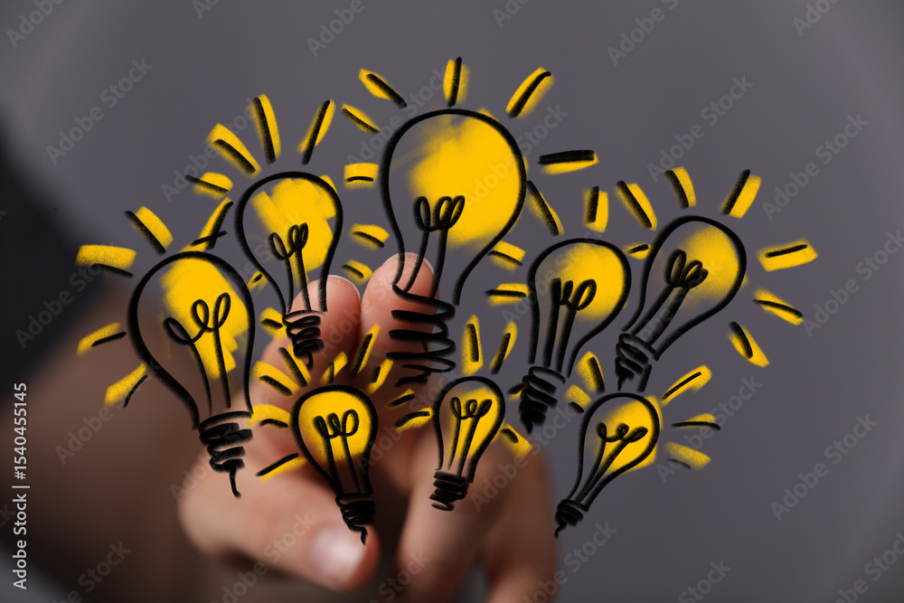 Aufkleber image of a hand selecting multiple glowing lightbulb ideas, symbolizing innovation and creativity.