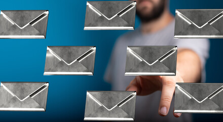 Image of a man interacting with digital email icons, representing communication and technology.