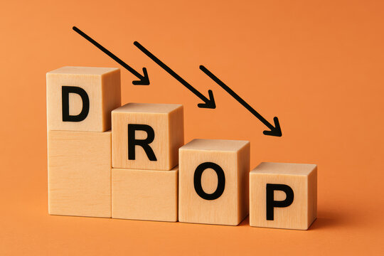 A conceptual representation decline shows wooden blocks arranged stepwise with downward arrows symbolizing loss and reduction in business contexts