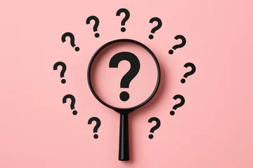 Selbstklebende Fototapeten Curiosity drives the search for clarity as focus sharpens on key questions under a magnifying glass © tonstock