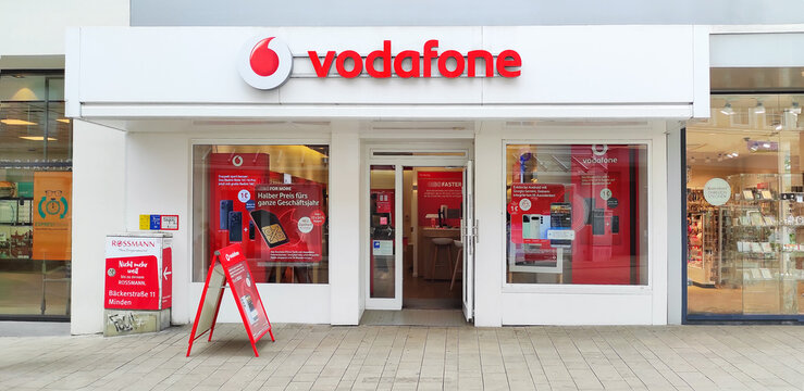 Germany, Minden - May 27, 2025: Vodafone Group is a British company, one of the world's largest mobile operators. The exterior of store is displayed showcasing its recognizable red logo and branding.