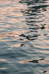 Golden blue sparkling water under the sunset