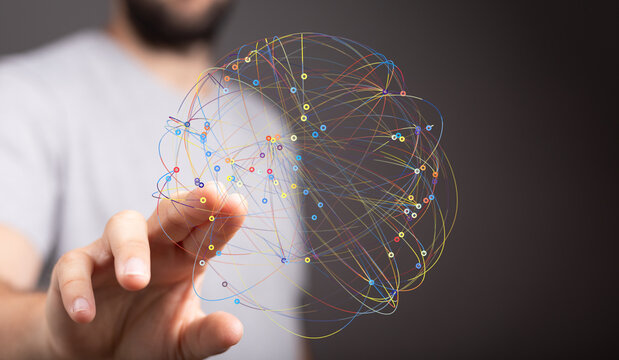 Abstract image of a hand interacting with a colorful network sphere, representing global connections and data visualization.