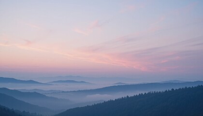 Fototapeta premium Majestic Mountain Sunrise Over Misty Valleys Before the Break of Dawn