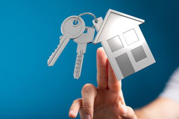 Image of house keys and home icon. Perfect for real estate, home buying, and property concepts.