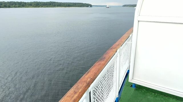 View from the ship's decks of the calm river and oncoming ships
