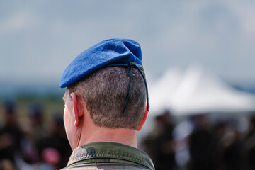 French soldier wearing camouflage uniform with background
