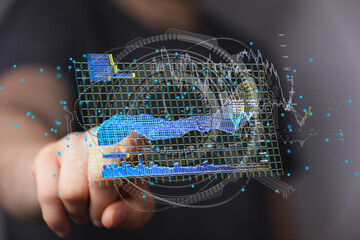 Person interacting with a holographic 3D business analytics dashboard.  Data visualization, charts,...