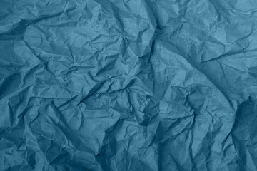 Abstract wrinkled blue crumpled paper texture background