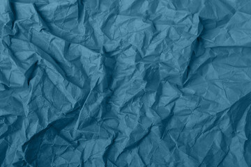 Abstract wrinkled blue crumpled paper texture background