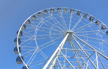 Ferris wheel on a summer day, close-up.	

