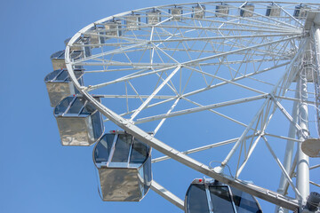 Ferris wheel on a summer day, close-up.	
