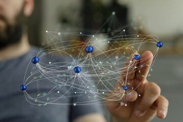 Abstract image of a man interacting with a complex network visualization.