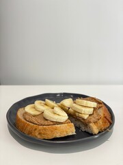 Rye bread toast with peanut butter and banana