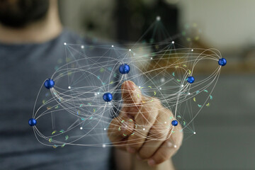 Abstract image of a hand interacting with a digital network, representing global connectivity and...