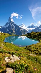 Naklejka premium alpine tranquility: a serene lake mirroring snow-capped peaks under a clear sky