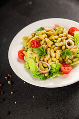 Bean salad green leaf lettuce, tomato, onion vegetables dish fresh delicious gourmet food background on the table rustic food top view copy space keto and paleo diet vegan and vegetarian food